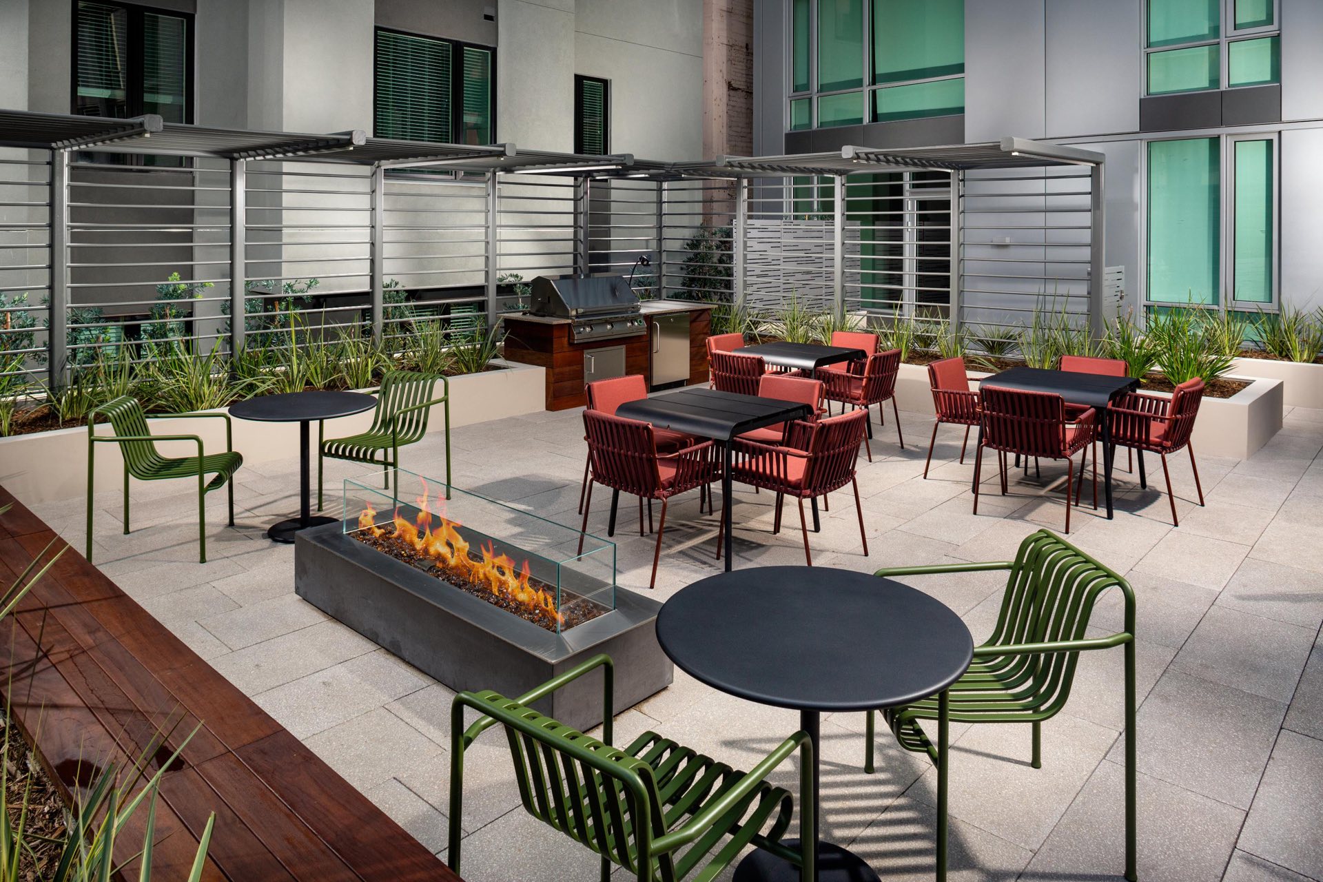 Patio with grill, tables, and firepit